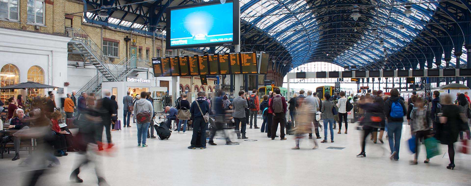 People at a UK train station.